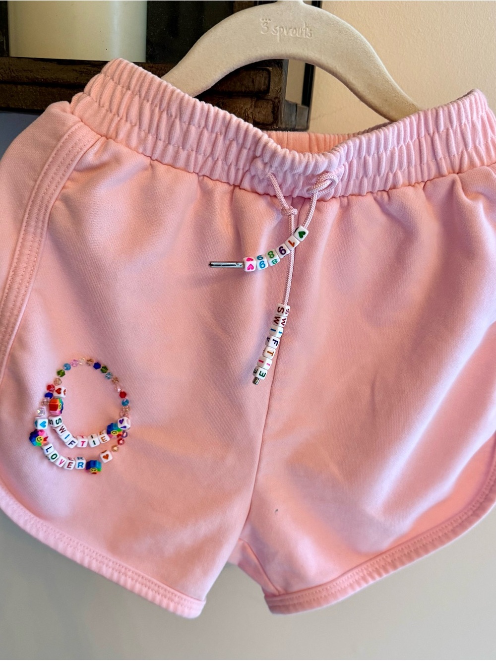 Lola + The Boys Girls’ Pink Drawstring Shorts with Swiftie/Lover Beaded Accent